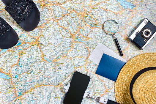 Travel plan, trip vacation accessories for trip, tourism mockup - Outfit of traveler on map background. Flat lay and copyspace. Still life