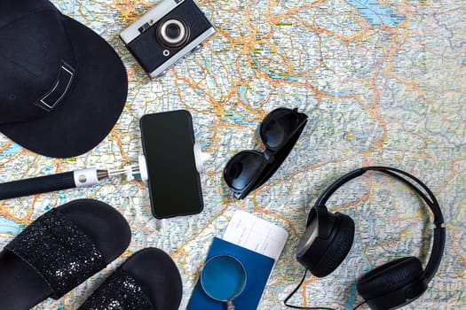 Travel plan, trip vacation accessories for trip, tourism mockup - Outfit of traveler on map background. Flat lay and copyspace. Still life