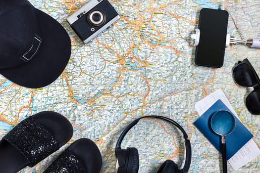 Travel plan, trip vacation accessories for trip, tourism mockup - Outfit of traveler on map background. Flat lay and copyspace. Still life