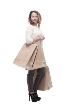 casual young woman with shopping bags. isolated on a white background.
