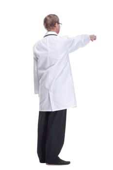 in full growth.Mature doctor with a stethoscope reading an ad on a white screen. isolated on a white background.