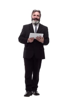 in full growth. a smiling business man with a digital tablet. isolated on a white