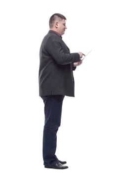 side view. Mature business man with a digital tablet. isolated on a white background.
