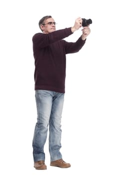 full-length.casual man with a camera. isolated on a white background.