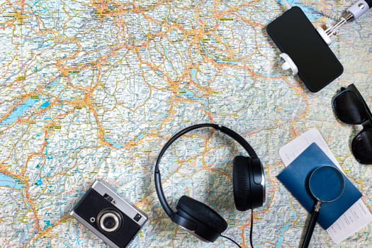 Travel plan, trip vacation accessories for trip, tourism mockup - Outfit of traveler on map background. Flat lay and copyspace. Still life