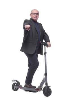 side view . Mature man with electric scooter looking forward. isolated on a white background