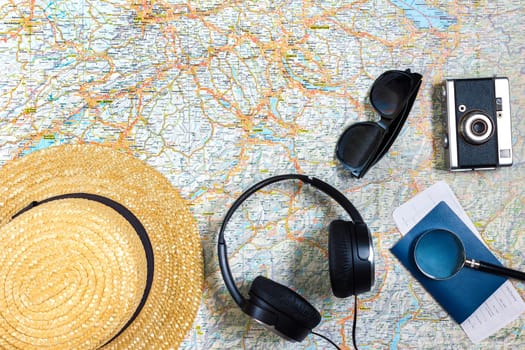 Travel plan, trip vacation accessories for trip, tourism mockup - Outfit of traveler on map background. Flat lay and copyspace. Still life