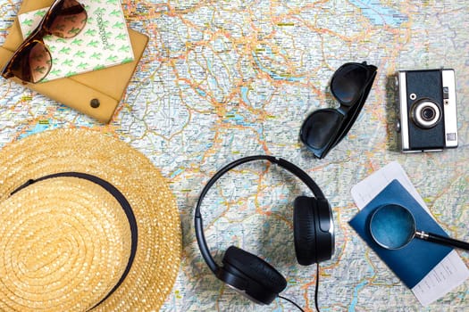 Travel plan, trip vacation accessories for trip, tourism mockup - Outfit of traveler on map background. Flat lay and copyspace. Still life