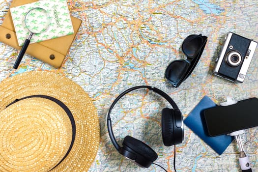 Travel plan, trip vacation accessories for trip, tourism mockup - Outfit of traveler on map background. Flat lay and copyspace. Still life
