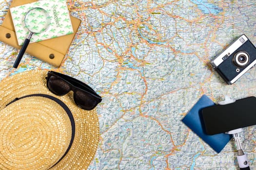 Travel plan, trip vacation accessories for trip, tourism mockup - Outfit of traveler on map background. Flat lay and copyspace. Still life