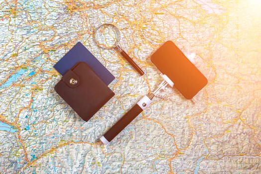 Travel plan, trip vacation accessories for trip, tourism mockup - Outfit of traveler on map background. Flat lay and copyspace. Still life. Sun flare