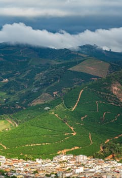 Spectacular landscape of Alto Caparao, a coffee town nestled in a valley surrounded by endless rows of coffee fields, mountains and mist.