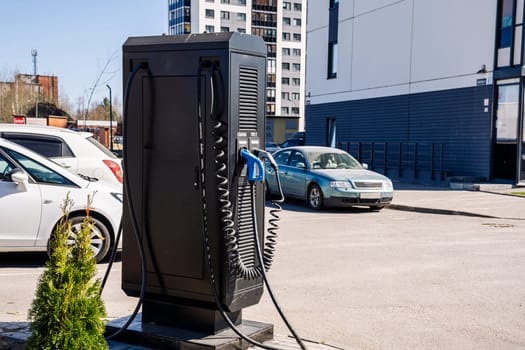 Electric vehicle Charging station. plug-in power cable. A power supply for charging an electric vehicle. Eco electric concept. Car charger. Alternative fuel. green energy technology