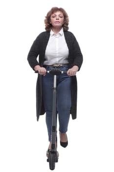 in full growth. modern adult woman with an electric scooter. isolated on a white background