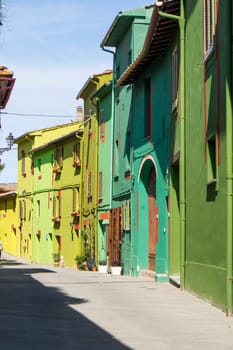 Photographic documentation of the colored houses in Ghizzano Pisa Italy 