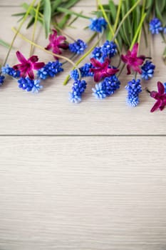 beautiful bouquet of spring flowers on a wooden table, rustic style.