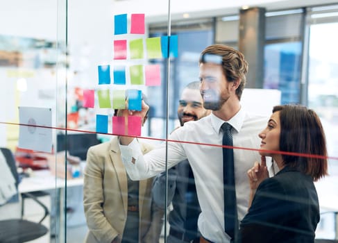 Collaboration, team of colleagues working on strategy and schedule in office. Teamwork, communication and coworkers planning or brainstorming ideas together for project or assignment at workplace.