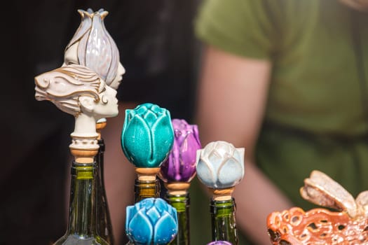 Handmade ceramic stoppers for bottles. Bottle caps in the shape of flowers. High quality photo