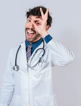 Happy doctor gesturing approval isolated, Latin doctor approving on isolated background. Handsome doctor approving and recommending isolated