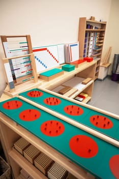 Classroom of Montessori kindergarten. The colorful Montessori material. Concept of children learning toy