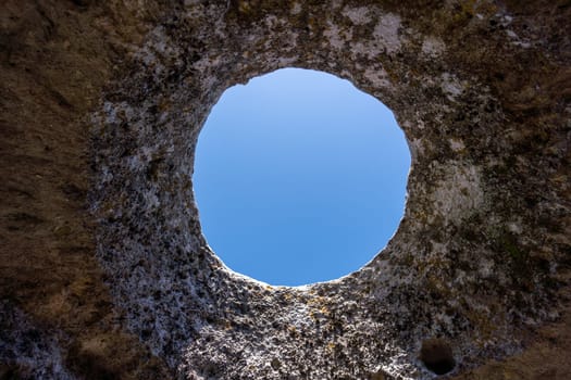 Ancient cave city. Inside the cave, view from the window