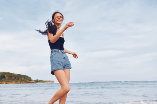 running woman space young long lifestyle sea sunset sand beach freedom happiness fun smile hair copy person travel relax tan positive summer walking