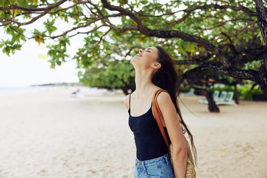 smiling woman sunset smile ocean vacation sea happiness water adult beach nature sunlight long copy-space outdoor young coast sand summer female hair