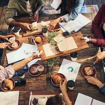 Having a productive lunch. High angle shot of a group of creative workers out on a business lunch