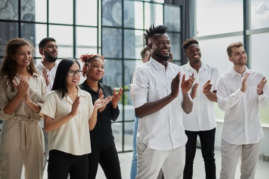 High angle view of multiethnic people cheering after a seminar