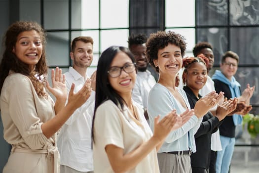 arge international group of happy people applauding together
