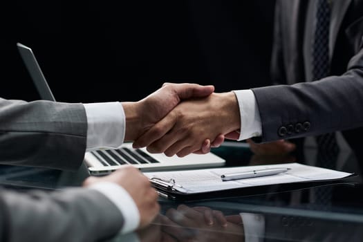 businessman shakes hands, making a deal with a lawyer. male judge legal