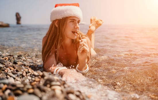 Woman travel sea. Happy tourist taking picture outdoors for memories. Woman traveler looks at the edge of the cliff on the sea bay of mountains, sharing travel adventure journey.