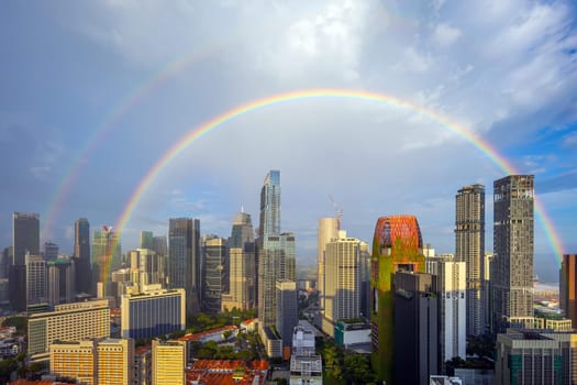 Downtown city skyline, cityscape of Singapore with rainbow