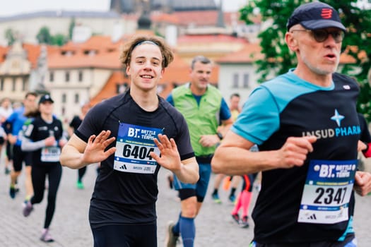 Prague, Czechia - 7th May 2023 - Group athletes runners run marathon in a sunlight