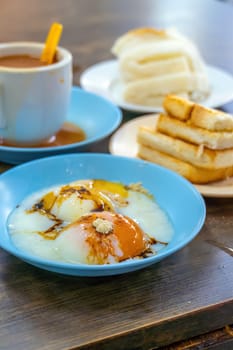 Traditional breakfast set and coffee, boiled eggs and toast, popular in Singapore and Malaysia