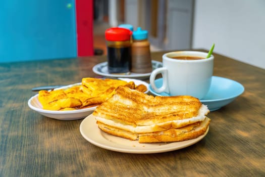 Traditional breakfast set and coffee, boiled eggs and toast, popular in Singapore and Malaysia