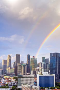 Downtown city skyline, cityscape of Singapore with rainbow