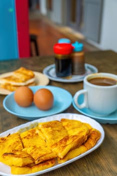 Traditional breakfast set and coffee, boiled eggs and toast, popular in Singapore and Malaysia