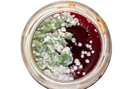 Mold in a jar of raspberry jam. Hazardous to health. Mold. High quality photo