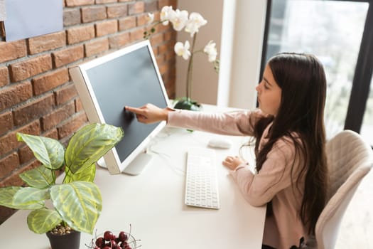 Smiling girl using laptop, student studying at home, digital education, teenager typing on computer browsing web, blogger influencer chatting online in social networks, woman working on pc in office