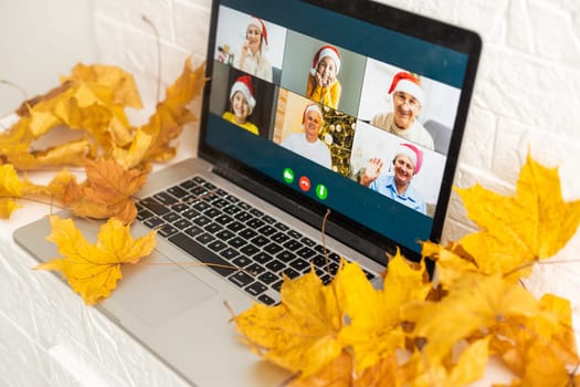 dry autumn leaves and laptop video chat.