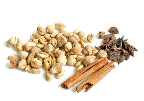 Heap on cardamon anise and cinnamon isolated on white background