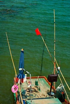 Small Wooden fishing boat coastal drift after returning from fishing