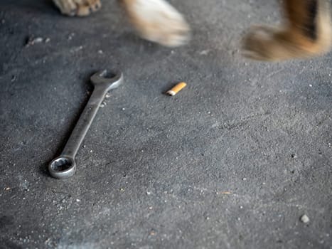 The Combination wrench on the rough concrete flooring