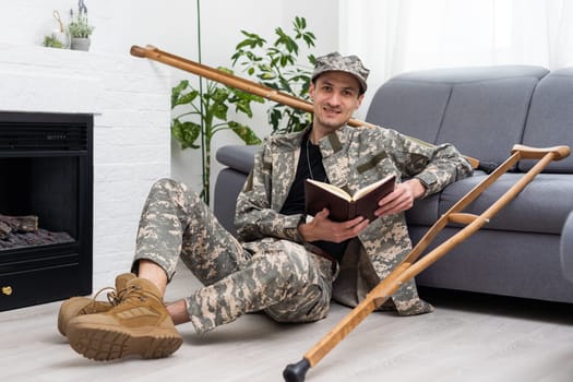 soldier in khaki military uniform on crutches.