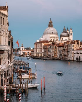 Scenic view of the Salute Roman Catholic church and minor basilica located in Punta della Dogana in the Dorsoduro sestiere of the city of Venice Italy on a cloudless summer evening. Copyspace.