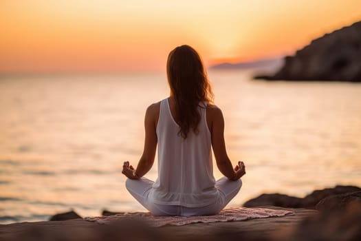 Unrecognizable woman sitting in lotus pose on the beach meditating, view from behind. Generative AI