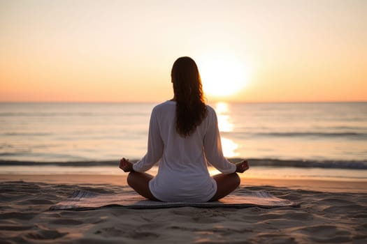 Unrecognizable woman sitting in lotus pose on the beach meditating, view from behind. Generative AI