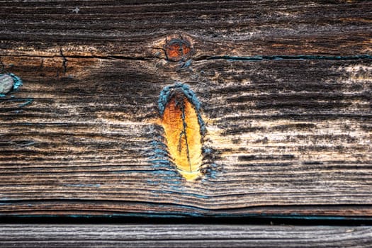 Close-up of an old board from a fence. Faded paint. Lost from time.