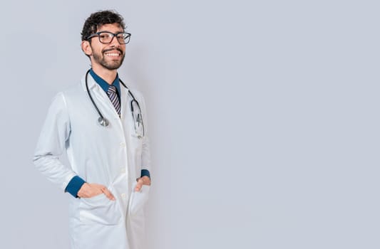 Portrait of happy doctor with hands in pockets  isolated. Happy latin doctor with copy space isolated